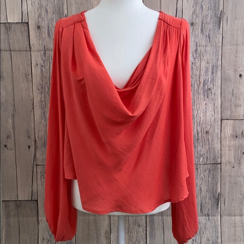 Free people orange blouse.